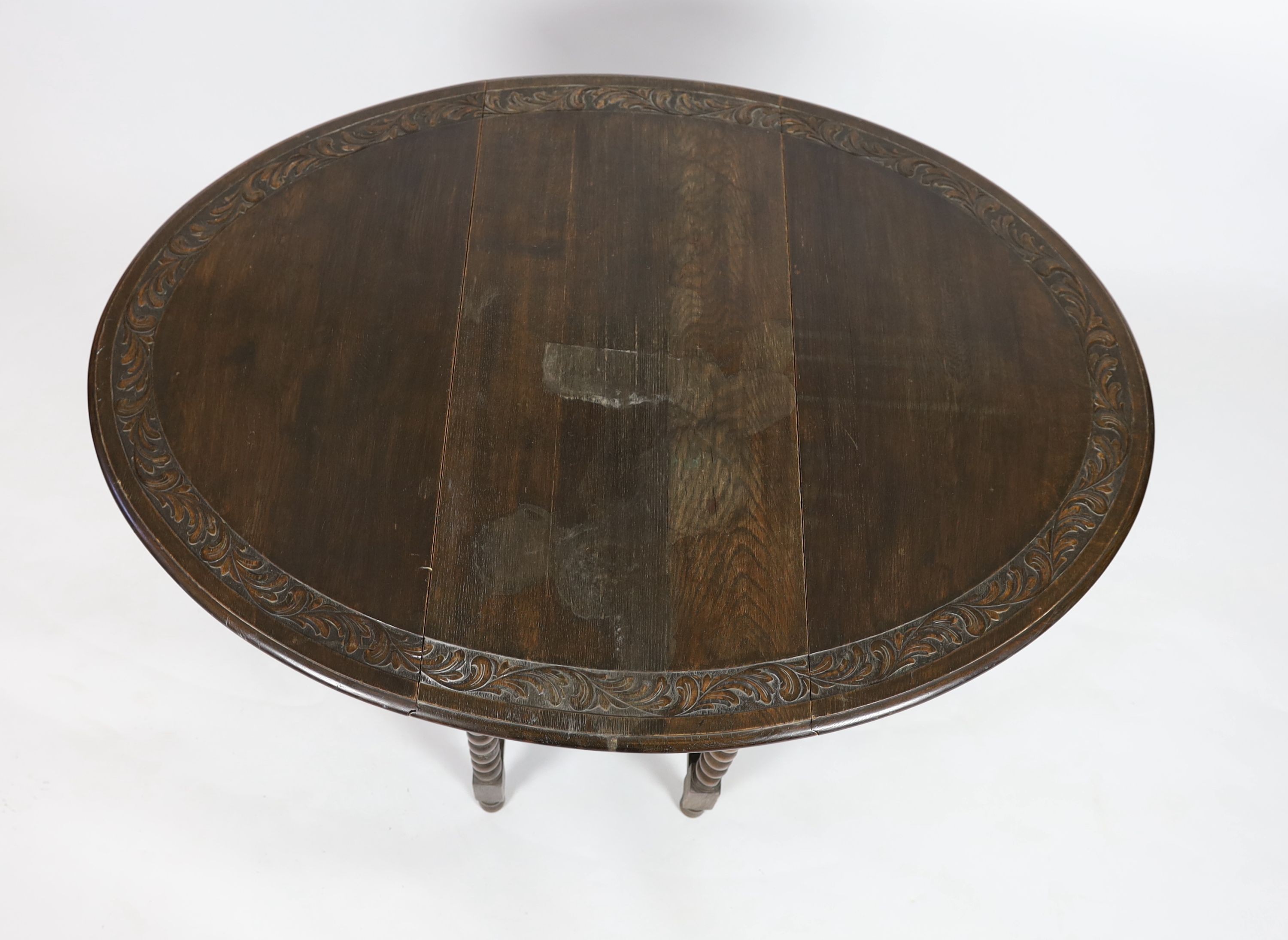 An early 20th century 18th century style oak gateleg dining table, width 98cm depth 46cm height 76cm